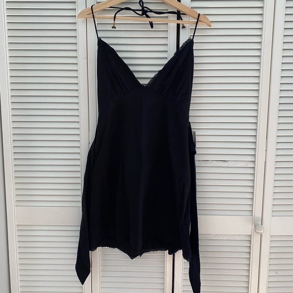 Cute little black dress with tag still on! Never worn.